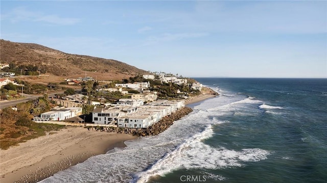 property view of water featuring a view of the beach and a mountain view