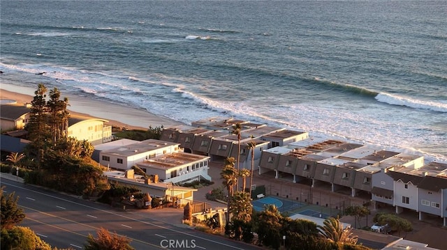 aerial view with a water view and a view of the beach