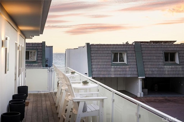 balcony at dusk with a water view