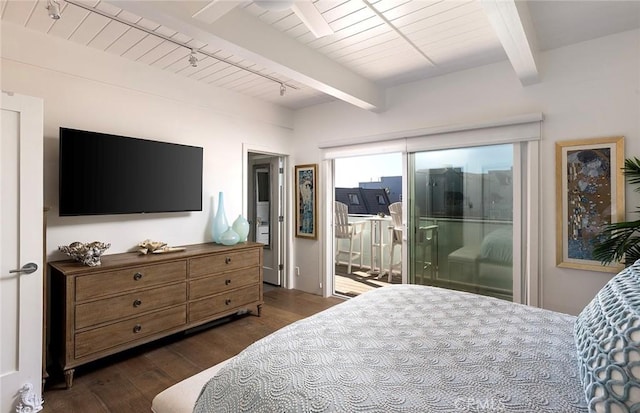 bedroom with beamed ceiling, dark wood-type flooring, track lighting, and access to exterior