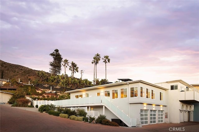 exterior space with a mountain view and a garage