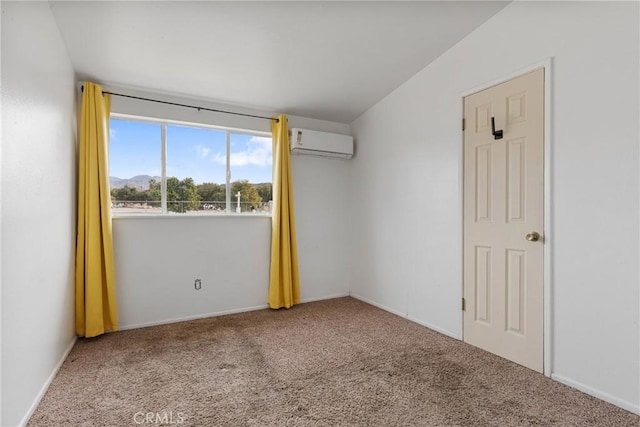 carpeted spare room with an AC wall unit