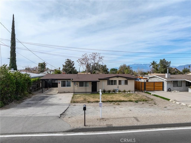 ranch-style house with a carport