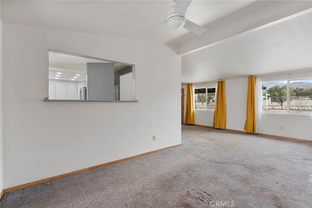 carpeted empty room with lofted ceiling and ceiling fan