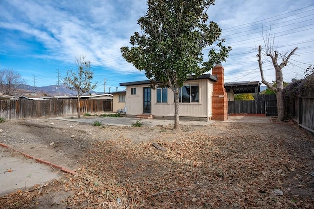 back of house with a patio area