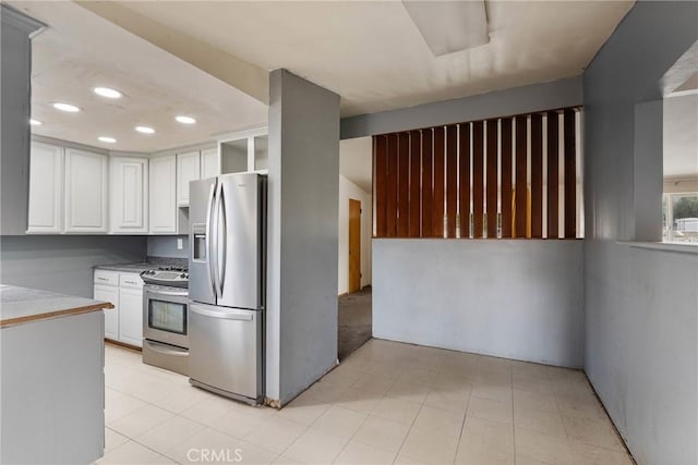 kitchen with appliances with stainless steel finishes and white cabinets