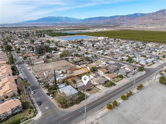 birds eye view of property featuring a mountain view