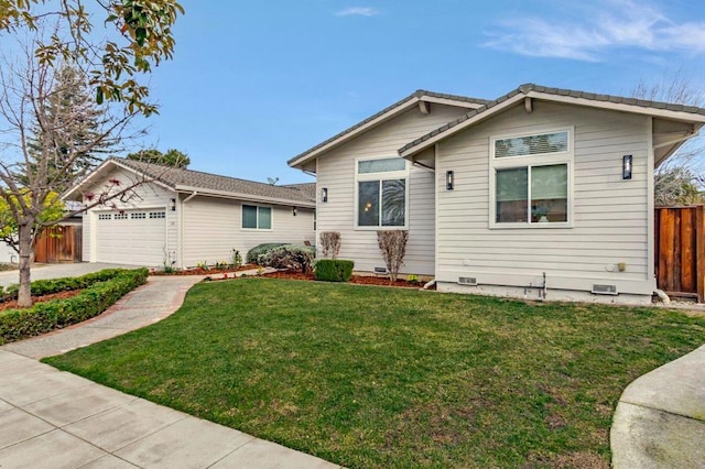 view of front of property with a garage and a front yard