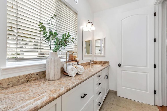 bathroom featuring tile patterned floors and vanity