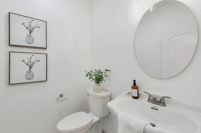 bathroom with toilet and sink