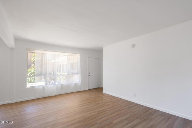 unfurnished room featuring wood-type flooring