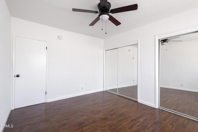 unfurnished bedroom with dark wood-type flooring and ceiling fan