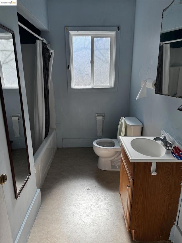 full bathroom featuring vanity, shower / bathtub combination with curtain, and toilet