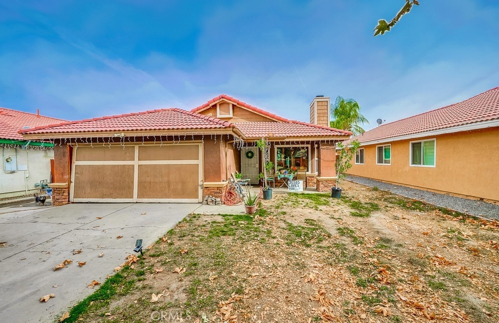 mediterranean / spanish-style home featuring a garage