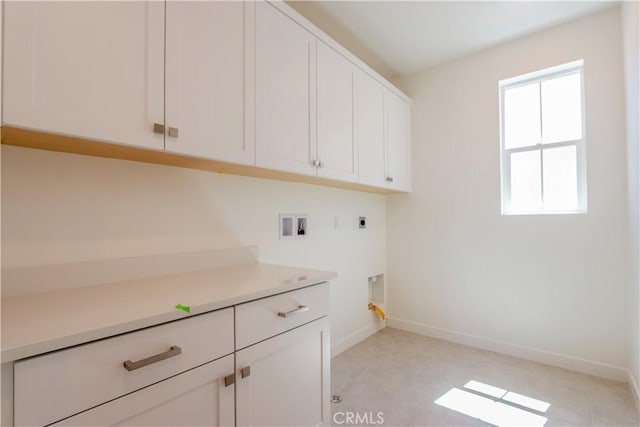 laundry area featuring cabinets, washer hookup, a healthy amount of sunlight, and hookup for an electric dryer