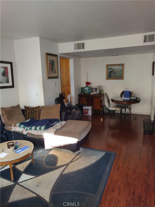 living room featuring dark wood-type flooring