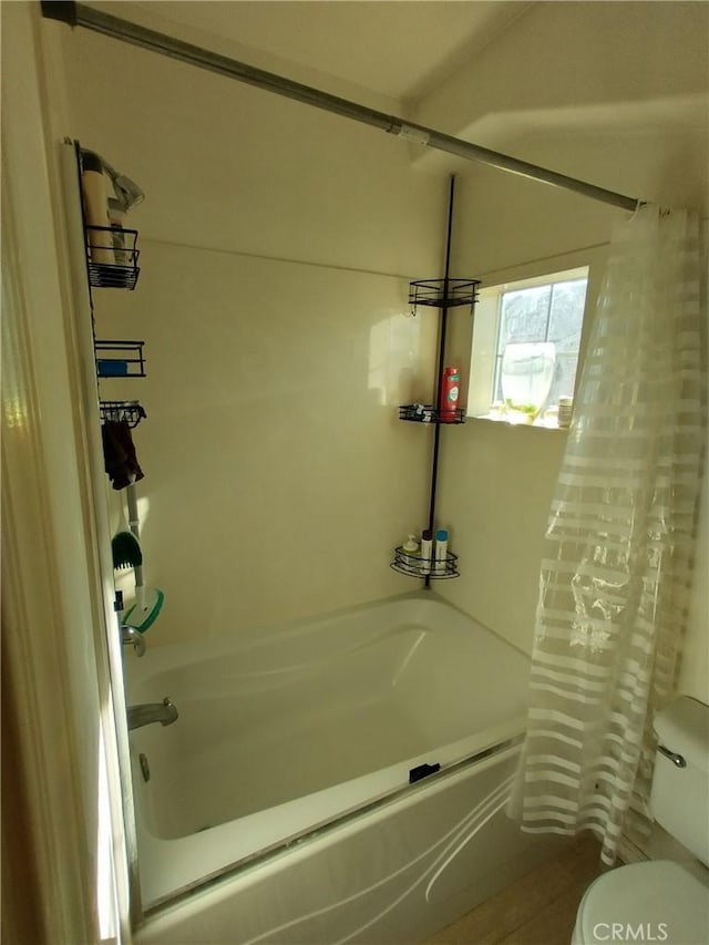 bathroom featuring shower / bath combination with curtain