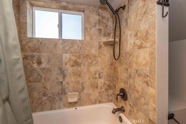 bathroom with shower / tub combo