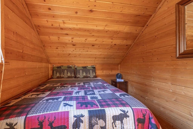 unfurnished bedroom with vaulted ceiling, wooden ceiling, and wood walls