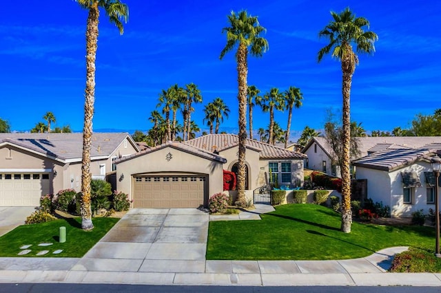 view of front of house with a garage and a front yard