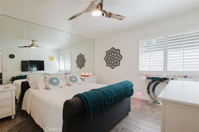 bedroom featuring ceiling fan and light wood-type flooring