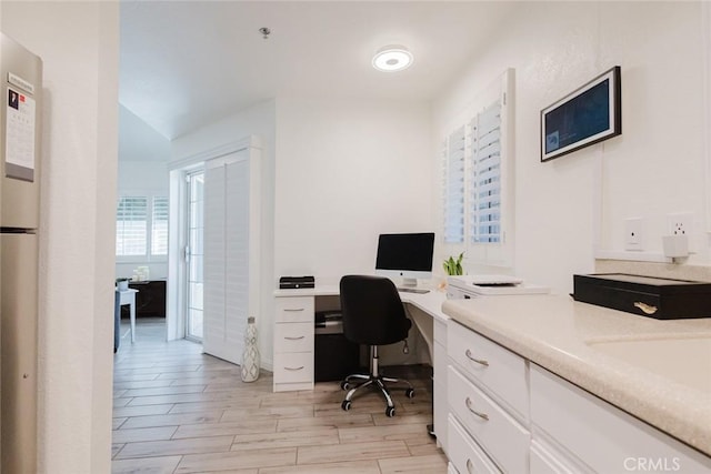 office space with light wood-type flooring