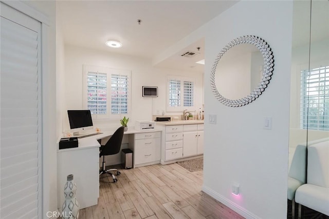 office space featuring light hardwood / wood-style floors