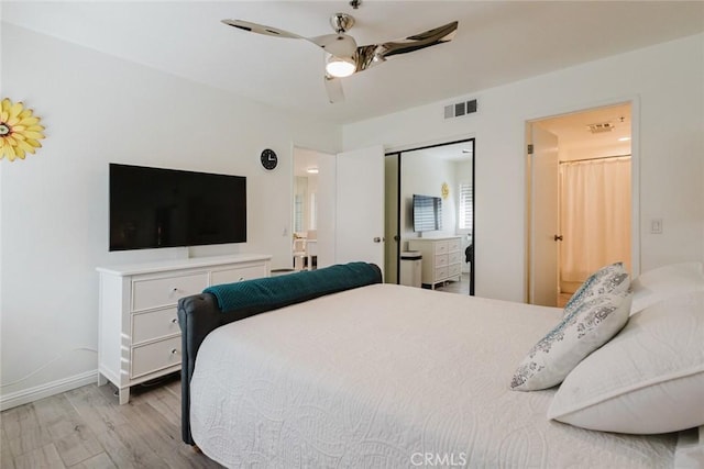 bedroom with ceiling fan, light hardwood / wood-style floors, and a closet