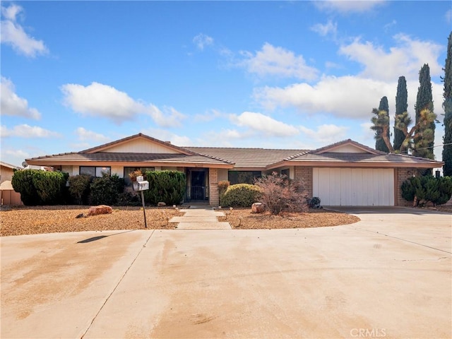 single story home with a garage