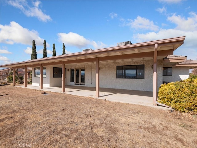 back of house with a patio