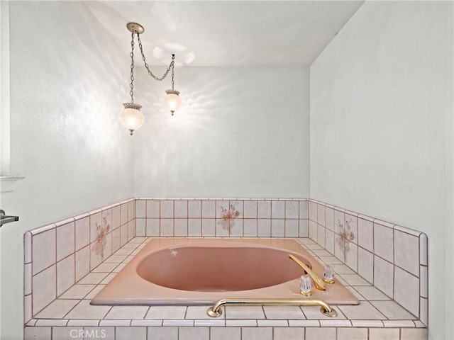 bathroom with tiled tub