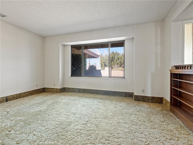 empty room with a textured ceiling