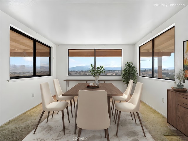 dining area with a mountain view