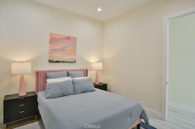 bedroom with recessed lighting and baseboards