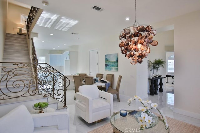 living area featuring stairway, baseboards, visible vents, and marble finish floor