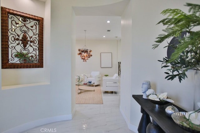 corridor with marble finish floor, recessed lighting, visible vents, and baseboards