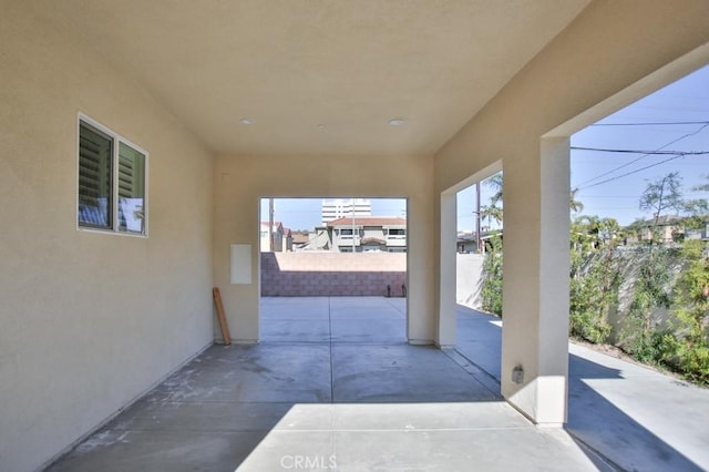 view of patio featuring fence