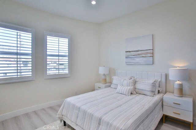 bedroom with light hardwood / wood-style flooring