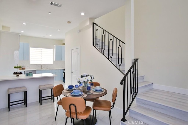 dining area featuring baseboards, stairway, visible vents, and recessed lighting