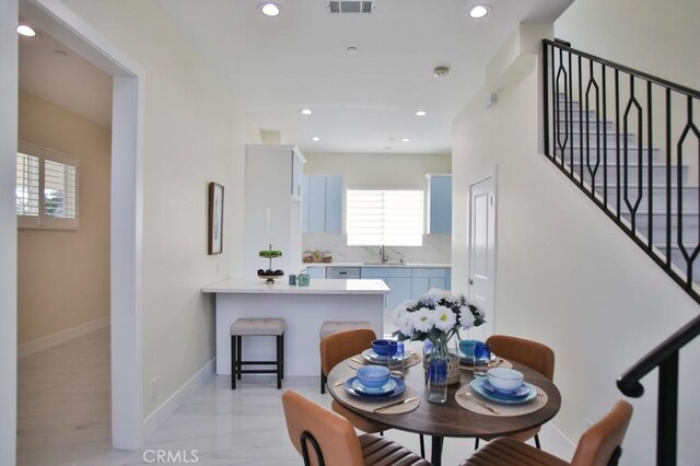 dining room featuring sink