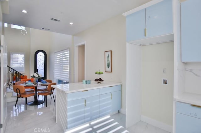 interior space with marble finish floor, recessed lighting, visible vents, and a healthy amount of sunlight