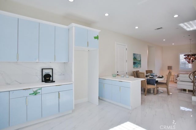 kitchen with visible vents, open floor plan, marble finish floor, light countertops, and recessed lighting