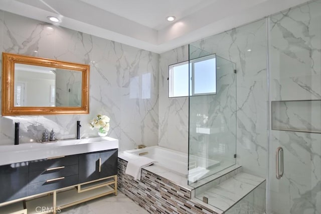 full bathroom with marble finish floor, vanity, a shower stall, a bath, and recessed lighting