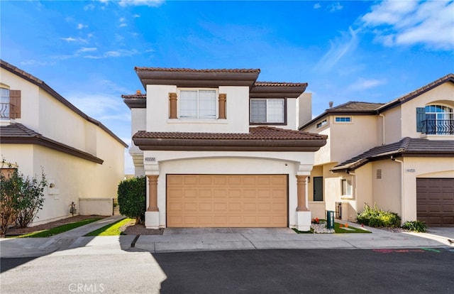 mediterranean / spanish-style house featuring a garage