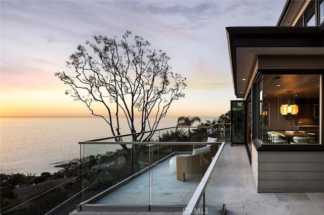 balcony at dusk with a water view