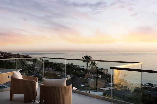 balcony at dusk with a water view