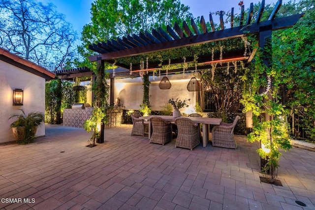 view of patio featuring a pergola and exterior kitchen