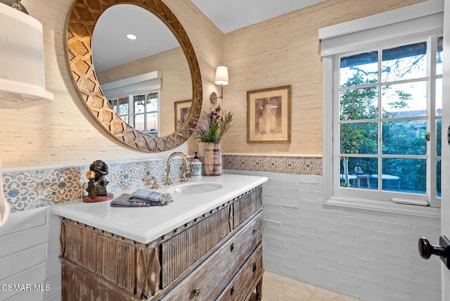 bathroom with vanity and plenty of natural light