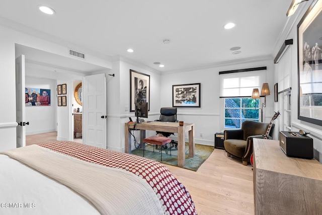 bedroom featuring ornamental molding and light hardwood / wood-style floors