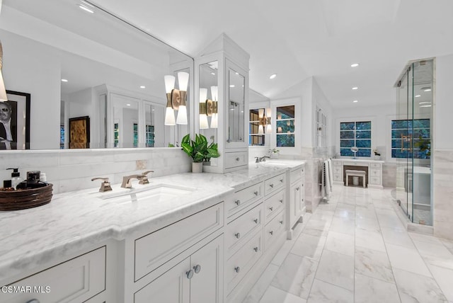 bathroom featuring vanity, lofted ceiling, walk in shower, and decorative backsplash